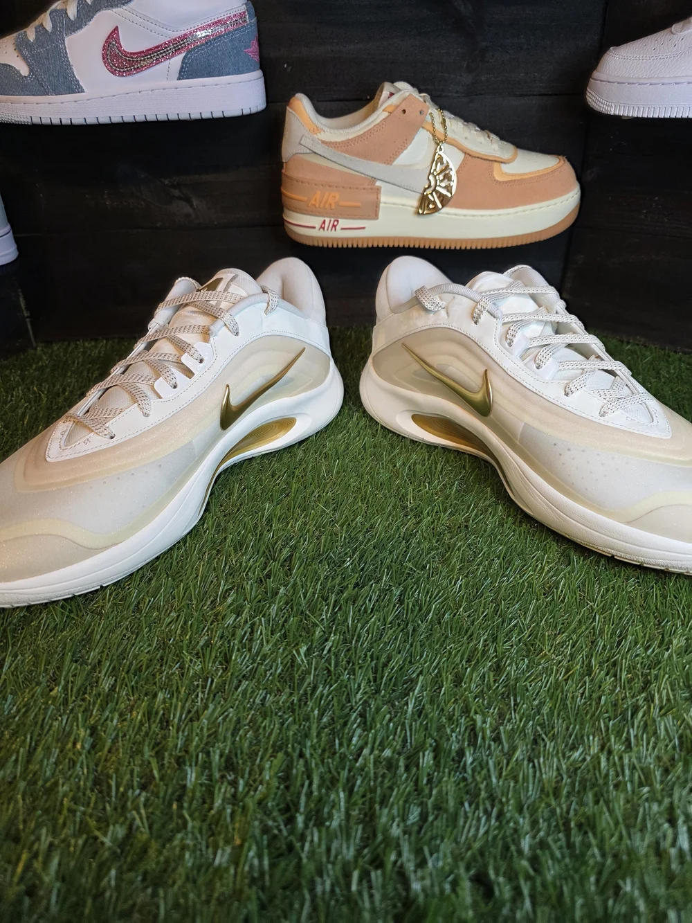 Nike Women's White Sneakers with Gold Swoosh